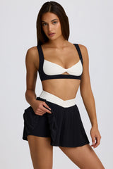 Soft Active Crossover Pleated Mini Skort in Black