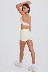 Four-Way Stretch High-Waist Mini Shorts in Cream